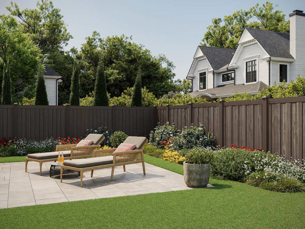 Brown composite privacy fence installed around a yard for a home in St. Louis Missouri